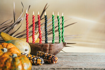 Kwanzaa, african holiday Kwanzaa with decoration of seven candles in red, black and green colors,...