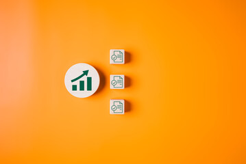 Graph goal icons on wooden blocks, Business strategy planning management, Progress of business and...