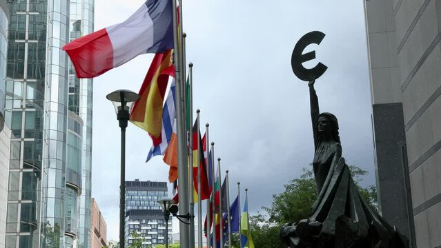 European Parliament headquarters. where European and world cultures meet. Peace Flags and states flags flying euro statues. Elections