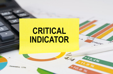 On business reports there is a calculator and a sign with the inscription - critical indicator