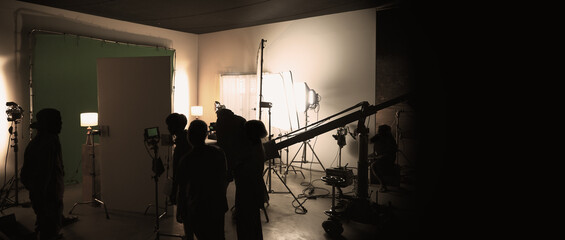 Silhouette images of making of or behind the scenes of video production which produced in the film...