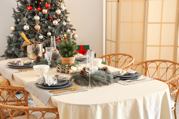 Christmas table setting with wreathes and pine cones