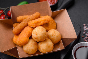Delicious nuggets, sticks and balls of mozzarella and parmesan cheese with salt and spices