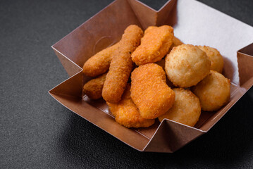 Delicious nuggets, sticks and balls of mozzarella and parmesan cheese with salt and spices