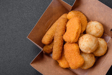 Delicious nuggets, sticks and balls of mozzarella and parmesan cheese with salt and spices