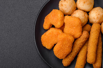 Delicious nuggets, sticks and balls of mozzarella and parmesan cheese with salt and spices