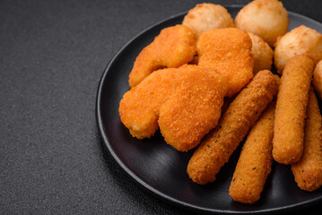 Delicious nuggets, sticks and balls of mozzarella and parmesan cheese with salt and spices