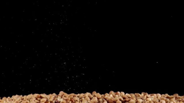 Buckwheat groats close-up. Raw large buckwheat grains close-up. Grains of buckwheat. Healthy organic food diet concept. Dry raw brown buckwheat.