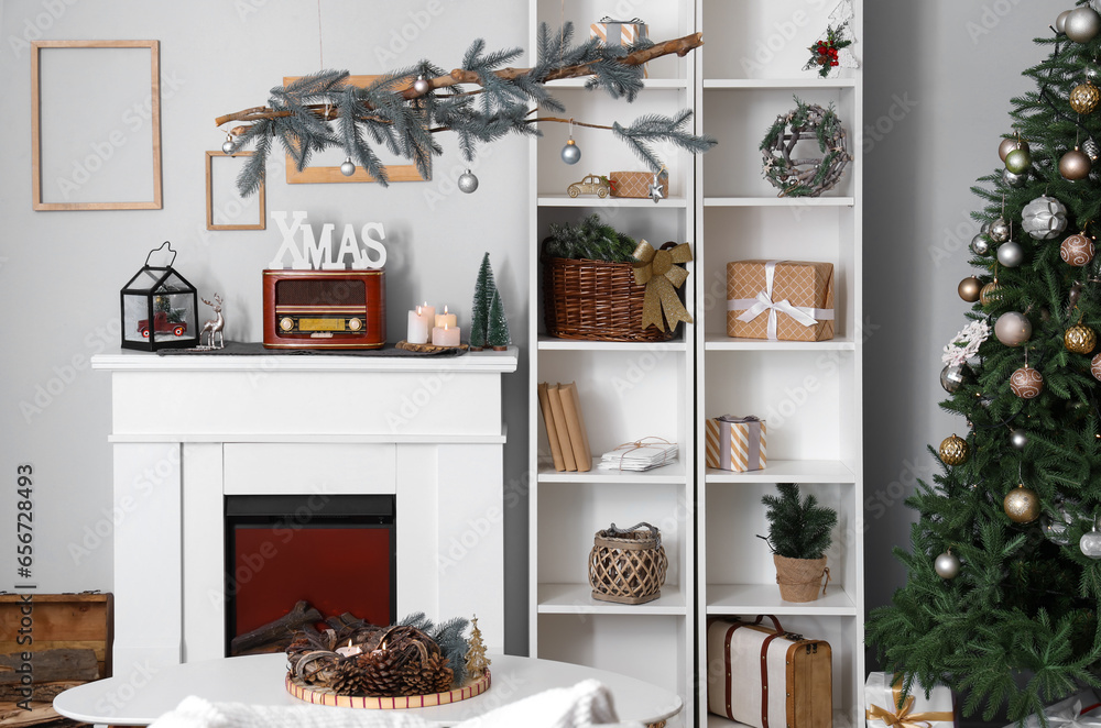 Wall mural interior of festive living room with christmas decor and fireplace