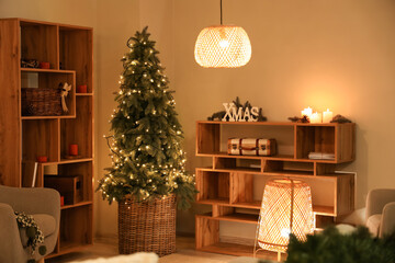Interior of festive living room with Christmas tree, glowing lamps and shelving units