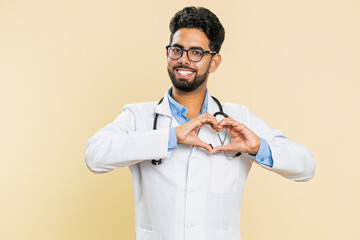 Indian doctor cardiologist man in love. Smiling attractive Arabian apothecary pharmacy guy makes...