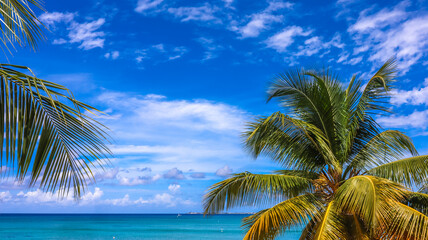 Seven Mile Beach in Grand Cayman, Cayman Islands, Features azure blue sky, crystal-clear waters,...