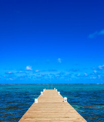 Obraz premium Boardwalk in beautiful Cayman Islands aerial view of Grand Cayman paradise in the Caribbean surrounded by the sea
