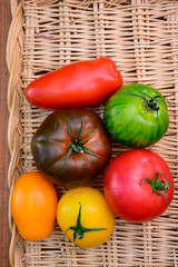 Variety of colorful tasty ripe french tomatoes on farmers market in Provence in summer close up