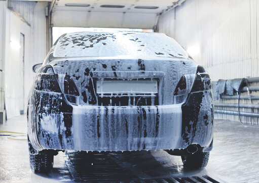 Car covered in foam at a car wash