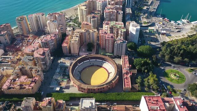 Aerial 4K video from drone to of Malaga bullfighting corrida arena, Malaga the port,  and the new residential areas of Malaga.Spain,Costa del sol, Andalusia (Series)