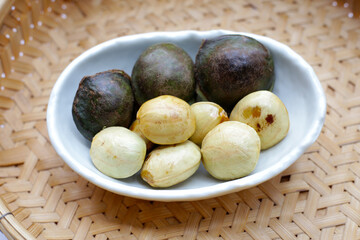 Djenkol fruit bean in white bowl