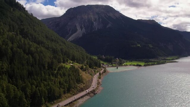 areal footage of  sunken church in Resia lake. Wonderful morning scene of Italian Alps, South Tyrol, Italy, Europe.