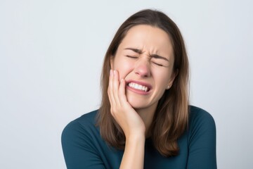 Fototapeta premium Confident and happy woman with brown hair smiling
