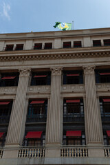Architectural details, building, downtown, sao paulo, brazilian flag raised at the top, Brazilian flag outdoors on top of a building 