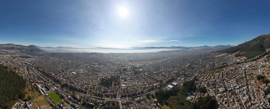 Aerial shot of Quito early in the morning, where you can see lots of volcanos.  