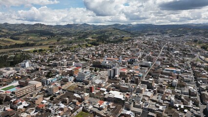 Tulcan is the capital of the province of Carchi located in Ecuador, aerial shot of the town in a...