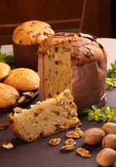 Delicious Panettone and slice with candied fruits, nuts and chestnuts
