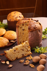 Delicious Panettone and slice with candied fruits, nuts and chestnuts