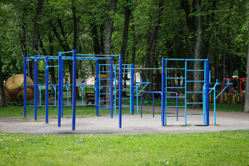 Fototapeta na wymiar Empty monkey bars on outdoor gym in park