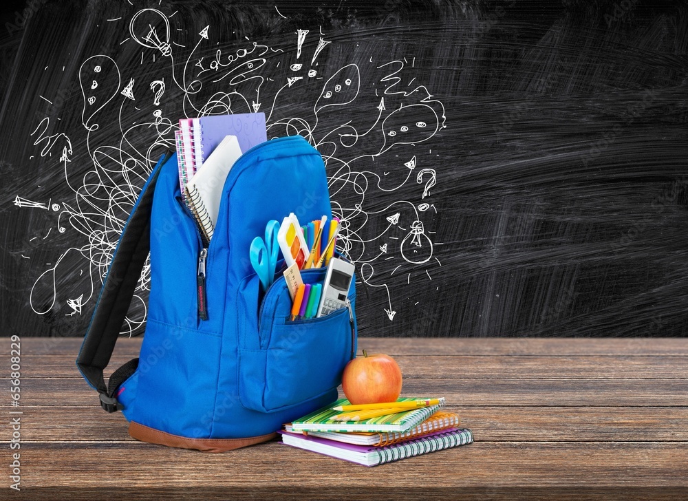 Canvas Prints School backpack with colored stationery in classroom.