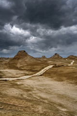 Yardang landforms landscape with storm clouds
