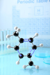 Molecular model on light surface against blurred background