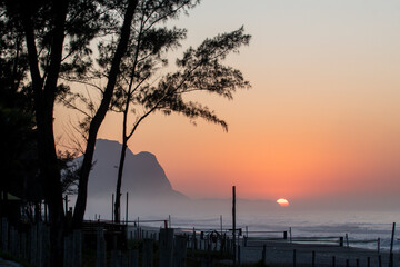 Recreio dos Bandeirantes beach at sunrise with the Pedra da Gavea mountain