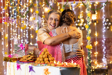 Obraz premium Woman hugging her daughter on Diwali festival