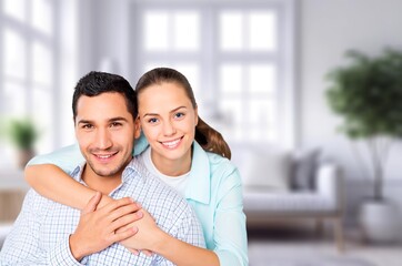 Obraz premium Happy young couple having fun at home in room