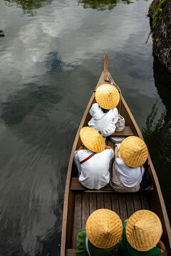 Aerial top view of tourists riding a tour boat in Kurashiki, Japan