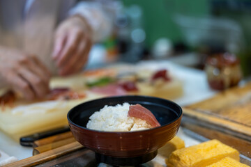 Japanese sushi man preparing the food in restaurant of Japan