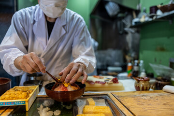 Japanese sushi man preparing the food in restaurant of Japan