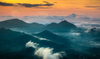 Dekokissen Watching the sunrise on the high mountains, far away is the famous coastal tourist city of Nha Trang © Quang