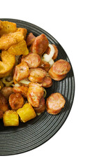 Partial view of portion of pepperoni sausage cut into slices, maniocs ( Mandiocas ) fried cassava and onion. Typical Brazilian food.