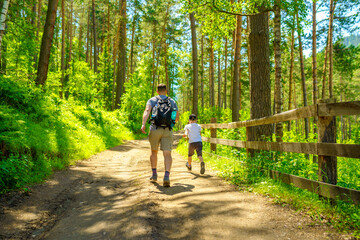 Father and son at walking in the countryside 