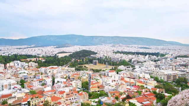 Athens Greece street cityscape high angle aerial Acropolis view on roof rooftop buildings residential houses, temple of Olympian Zeus and stadium