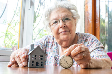Elderly Woman, Time and Invest in real estate concept