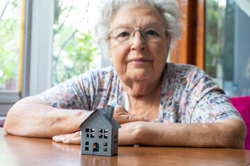 Elderly Woman and Invest in real estate concept