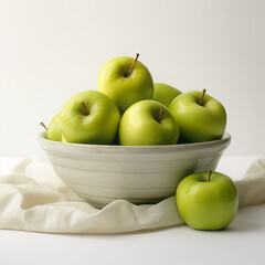 Green granny smith apples in bowl on a white background