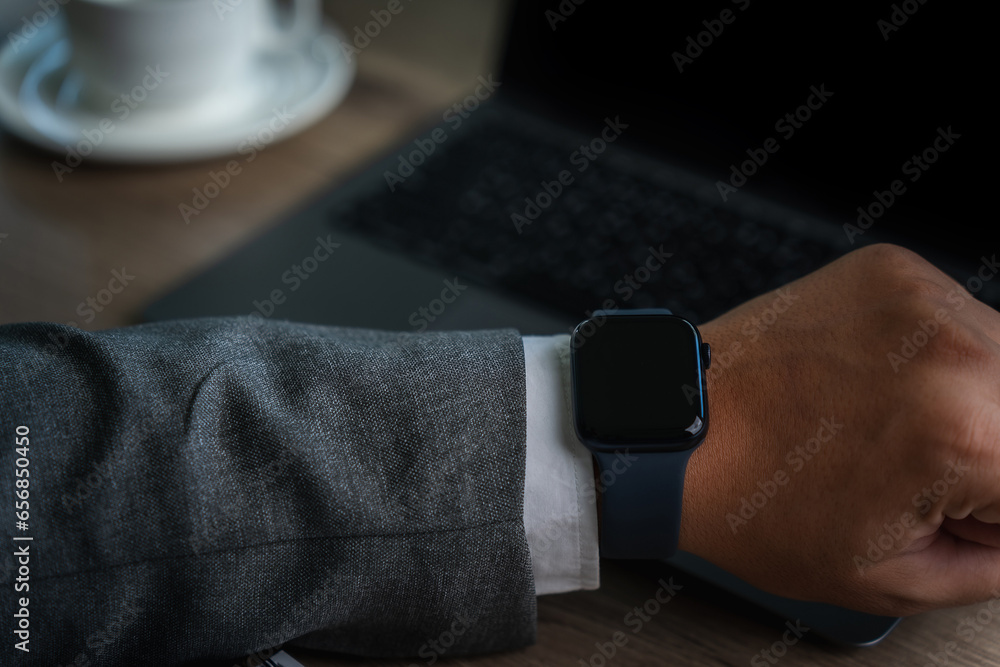 Poster man checking time on his smartwatch device close-up display clock checking lifestyle communication p