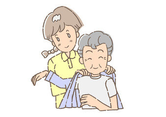 介護士に、着替えを手伝ってもらっている、おじいさん。