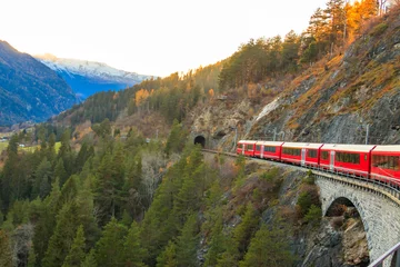 Papier Peint photo Viaduc de Landwasser Red passenger train on Rhaetian railway in Canton Graubunden, Switzerland at autumn