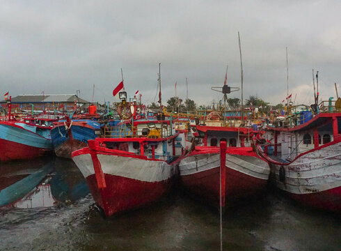 Row of fishing boats at the pier at teluk penyu beach, Cilacap, Indonesia.