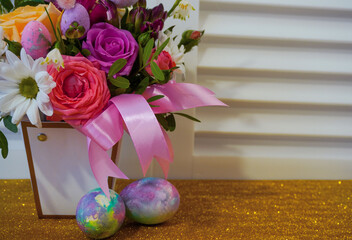 Happy easter! Flat Lay, Internet banner, postcard on Easter.  Bouquet of flowers and Easter eggs